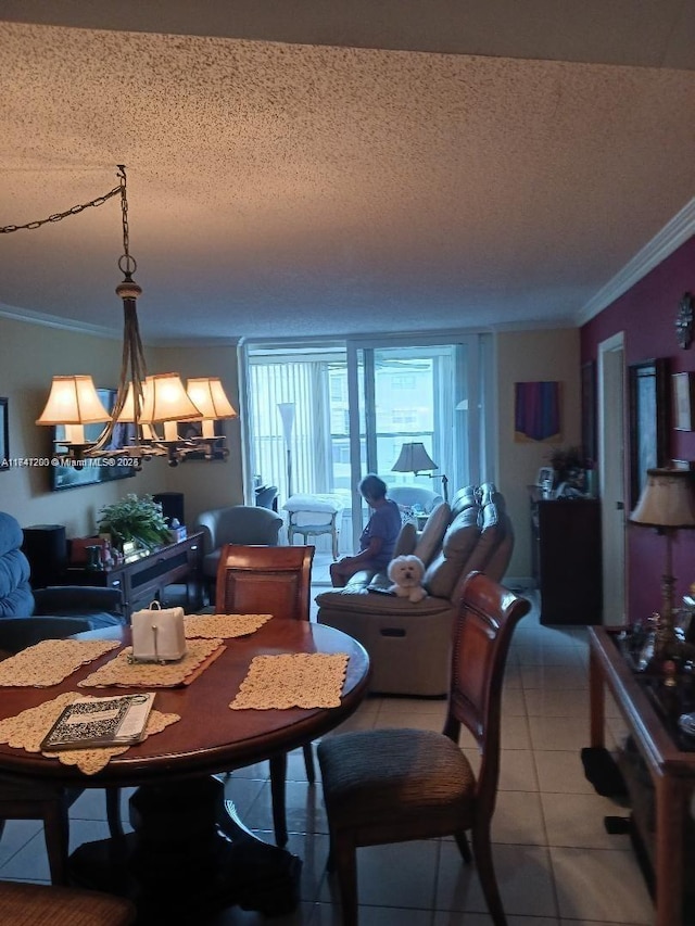 dining space featuring crown molding, a textured ceiling, a notable chandelier, and light tile patterned flooring