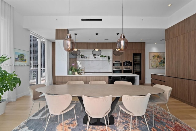 dining area featuring recessed lighting and light wood-style floors