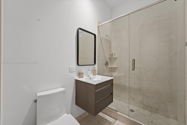 full bath featuring toilet, a shower stall, and vanity