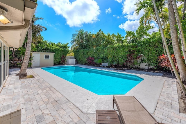 view of swimming pool with a fenced backyard, a fenced in pool, and a patio