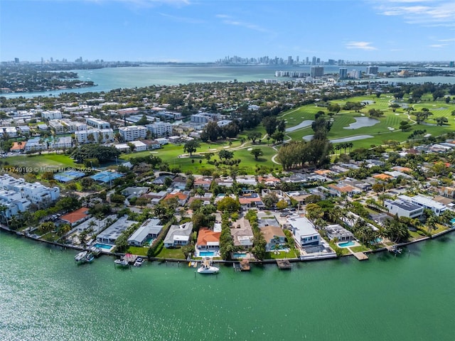 bird's eye view featuring a water view and a city view