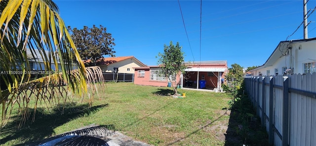 view of yard with a fenced backyard