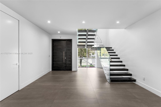 641 NW 7th St Rd, Miami, FL 33136 - foyer featuring stairway, baseboards, and recessed lighting
