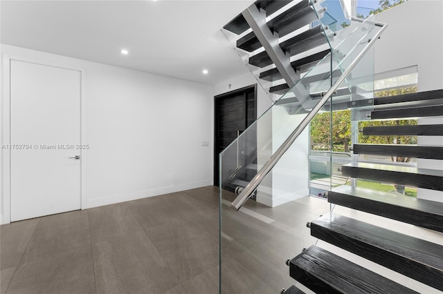 641 NW 7th St Rd, Miami, FL 33136 - staircase featuring recessed lighting and baseboards
