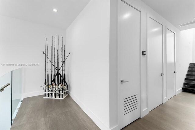 641 NW 7th St Rd, Miami, FL 33136 - corridor with baseboards and wood finished floors