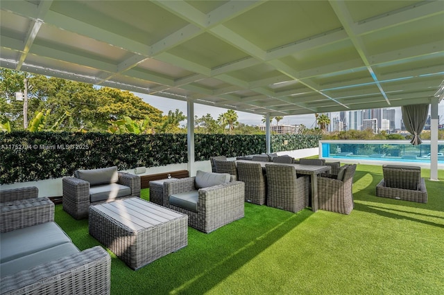 641 NW 7th St Rd, Miami, FL 33136 - view of patio with a fenced backyard, an outdoor living space, and a fenced in pool
