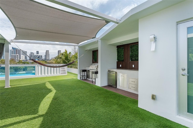 641 NW 7th St Rd, Miami, FL 33136 - view of yard with a patio area, a city view, and area for grilling