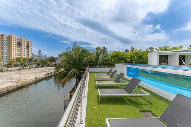 641 NW 7th St Rd, Miami, FL 33136 - view of pool featuring a water view, a fenced in pool, and a city view