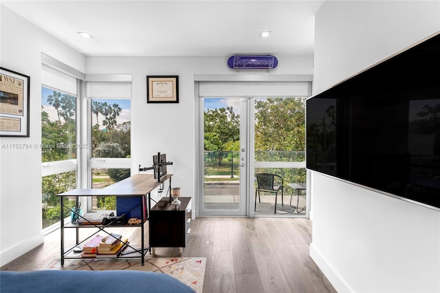 641 NW 7th St Rd, Miami, FL 33136 - doorway featuring plenty of natural light, baseboards, and wood finished floors