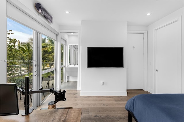 641 NW 7th St Rd, Miami, FL 33136 - bedroom featuring recessed lighting, ensuite bathroom, baseboards, and wood finished floors