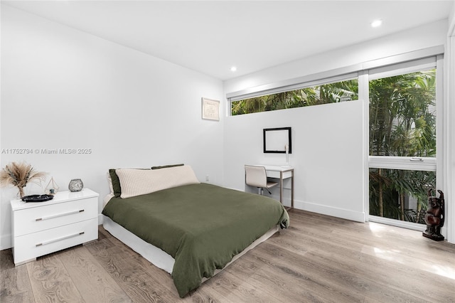 641 NW 7th St Rd, Miami, FL 33136 - bedroom with wood finished floors and recessed lighting