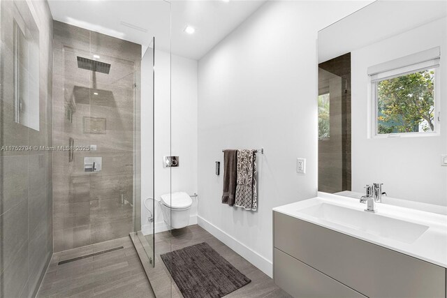 641 NW 7th St Rd, Miami, FL 33136 - full bath featuring vanity, a shower stall, toilet, and baseboards