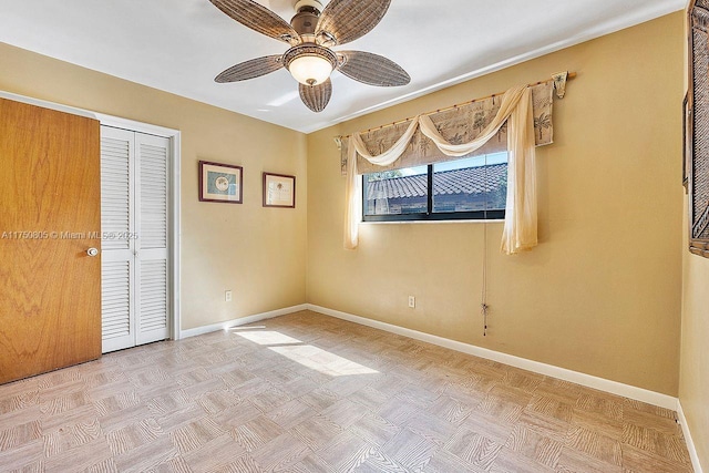 unfurnished bedroom featuring a closet, ceiling fan, and baseboards