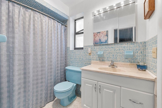 bathroom featuring a wainscoted wall, tile walls, toilet, and vanity