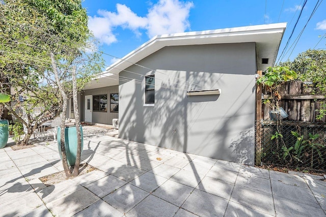 exterior space with a patio area and fence