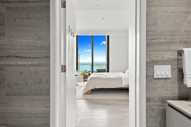 unfurnished bedroom with a water view