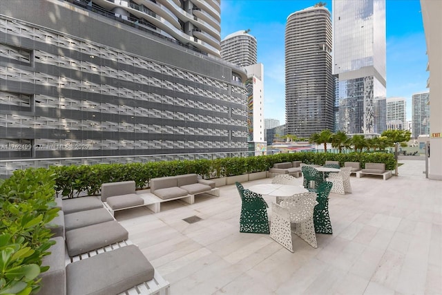 view of home's community featuring a view of city and a patio