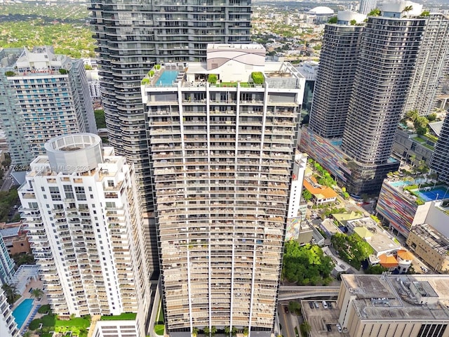 birds eye view of property with a view of city