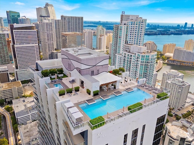 birds eye view of property featuring a view of city and a water view