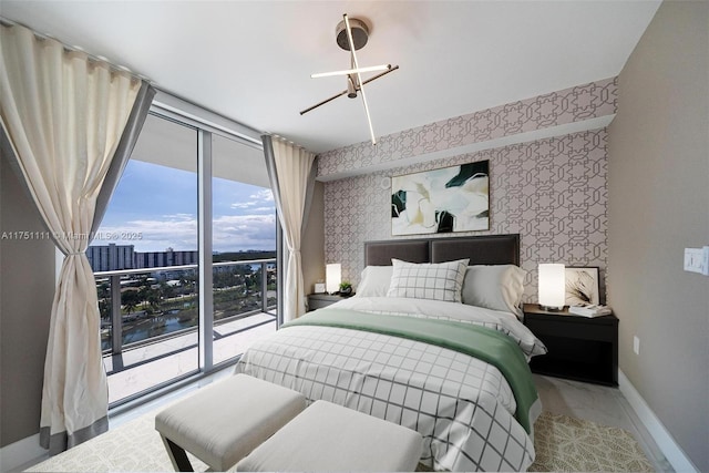 300 Sunny Isles Blvd Unit 4-1208, Sunny Isles Beach, FL 33160 - bedroom featuring wallpapered walls, multiple windows, marble look tile flooring, a wall of windows, and a city view