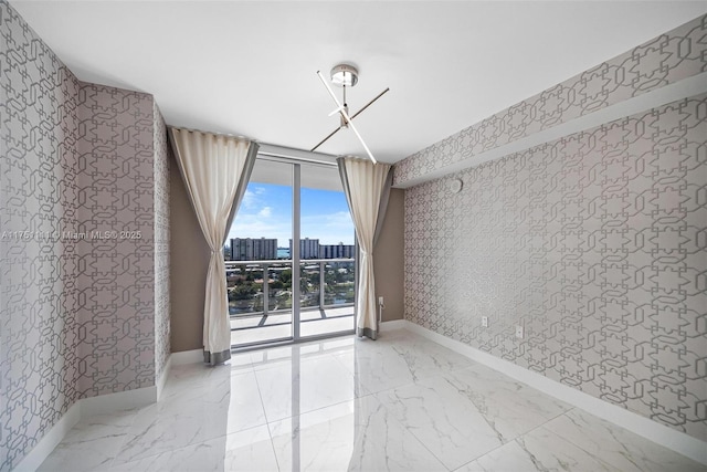300 Sunny Isles Blvd Unit 4-1208, Sunny Isles Beach, FL 33160 - unfurnished dining area with wallpapered walls, expansive windows, a city view, and light marble finish floors