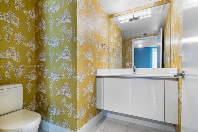 300 Sunny Isles Blvd Unit 4-1208, Sunny Isles Beach, FL 33160 - bathroom with wallpapered walls, vanity, and marble look tiles