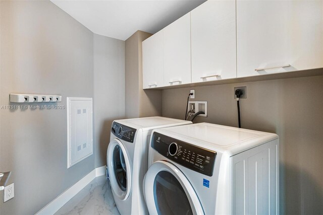 300 Sunny Isles Blvd Unit 4-1208, Sunny Isles Beach, FL 33160 - washroom with cabinet space, light marble finish floors, and washer and clothes dryer