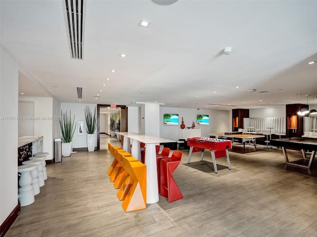 game room with light wood-style flooring, baseboards, and recessed lighting