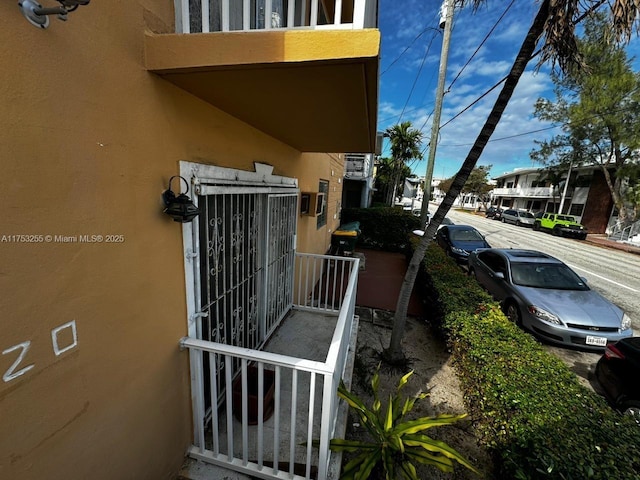 view of property exterior with a residential view and stucco siding