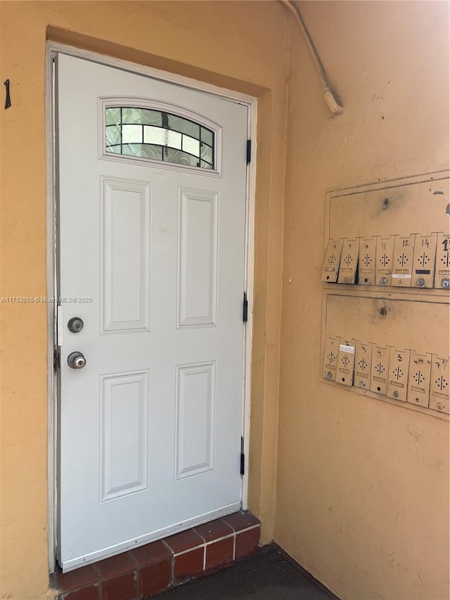 property entrance featuring stucco siding