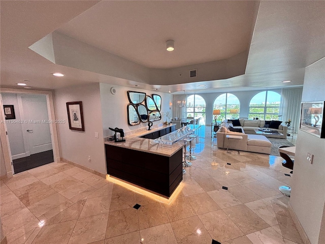 kitchen featuring recessed lighting, visible vents, and baseboards