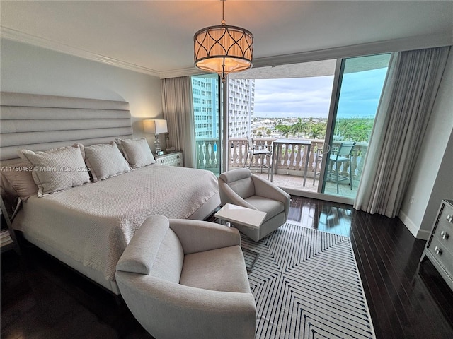 bedroom with wood finished floors, baseboards, access to outside, a wall of windows, and crown molding