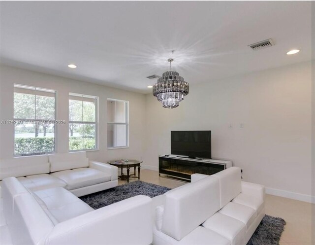 2910 NW 124th Way Unit 2910, Sunrise, FL 33323 - living room with a chandelier, baseboards, and recessed lighting