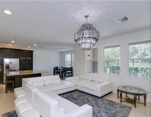 2910 NW 124th Way Unit 2910, Sunrise, FL 33323 - living room with a chandelier, recessed lighting, and wet bar