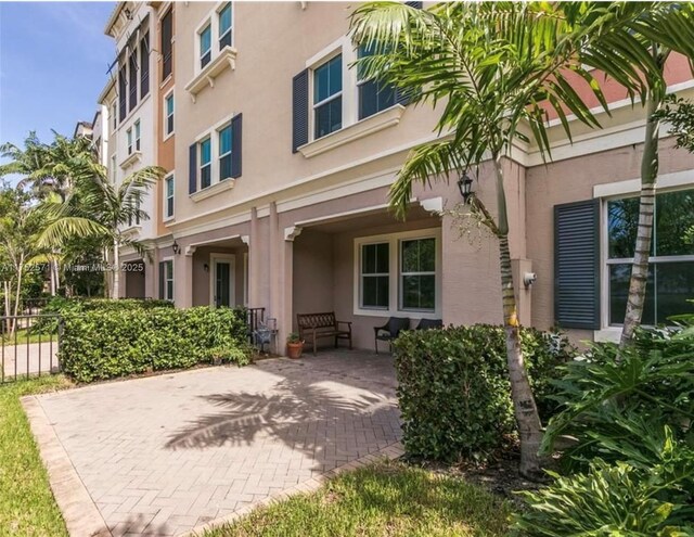 2910 NW 124th Way Unit 2910, Sunrise, FL 33323 - view of exterior entry with stucco siding