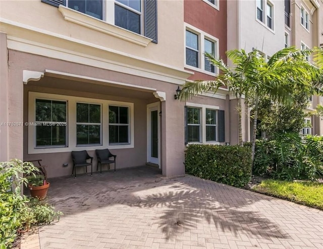 2910 NW 124th Way Unit 2910, Sunrise, FL 33323 - view of exterior entry featuring stucco siding
