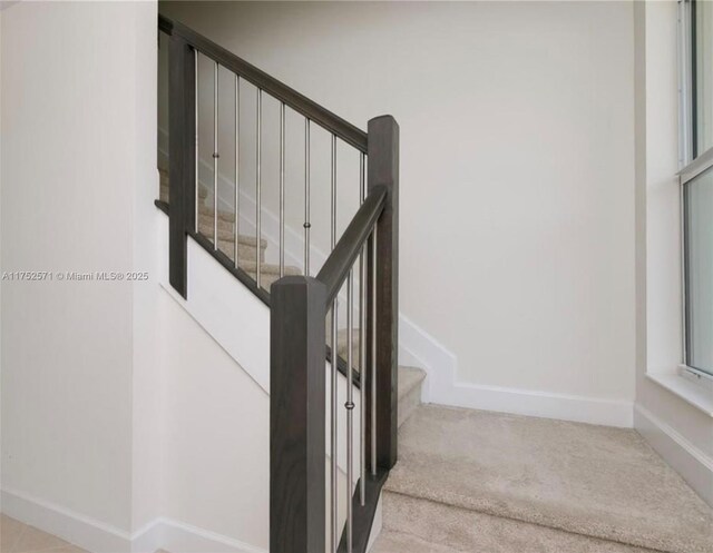 2910 NW 124th Way Unit 2910, Sunrise, FL 33323 - stairway featuring carpet and baseboards