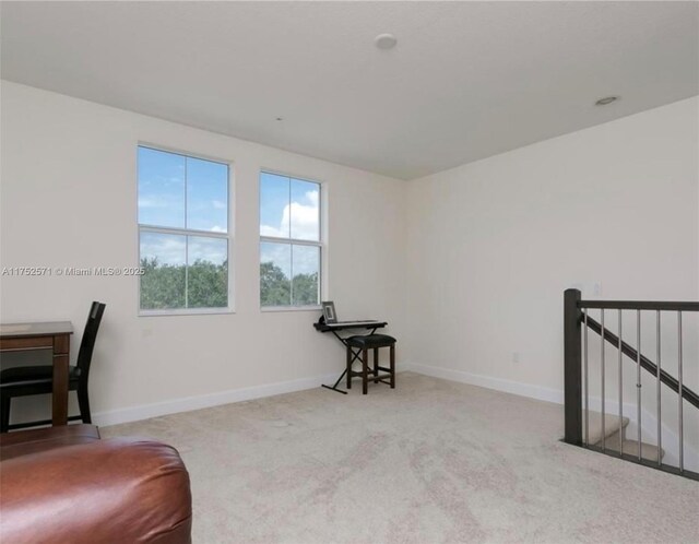 2910 NW 124th Way Unit 2910, Sunrise, FL 33323 - sitting room featuring carpet flooring, baseboards, and an upstairs landing
