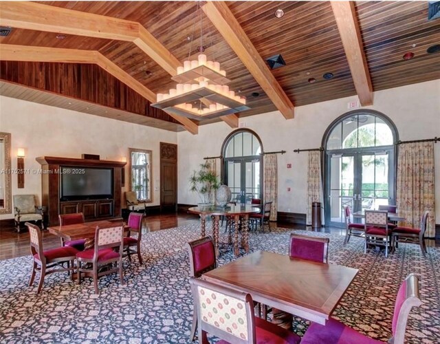 2910 NW 124th Way Unit 2910, Sunrise, FL 33323 - dining room featuring french doors, wood ceiling with exposed beams, high vaulted ceiling, and baseboards