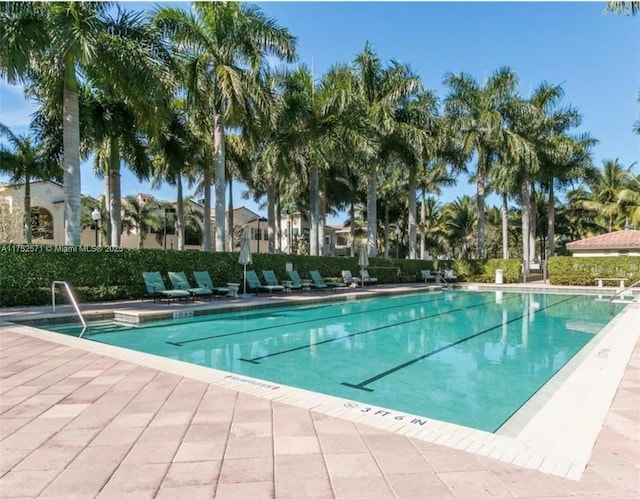 2910 NW 124th Way Unit 2910, Sunrise, FL 33323 - community pool with a patio