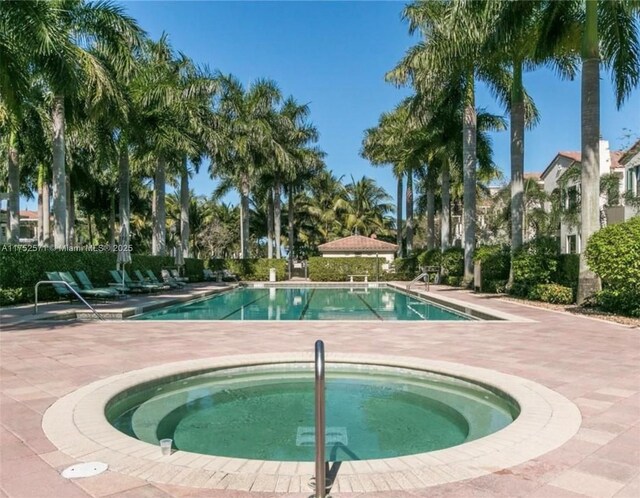 2910 NW 124th Way Unit 2910, Sunrise, FL 33323 - community pool featuring a patio area and a community hot tub