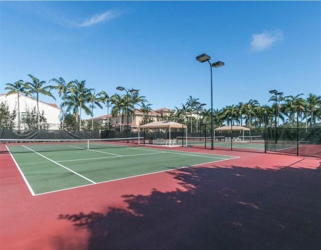 2910 NW 124th Way Unit 2910, Sunrise, FL 33323 - view of tennis court featuring community basketball court