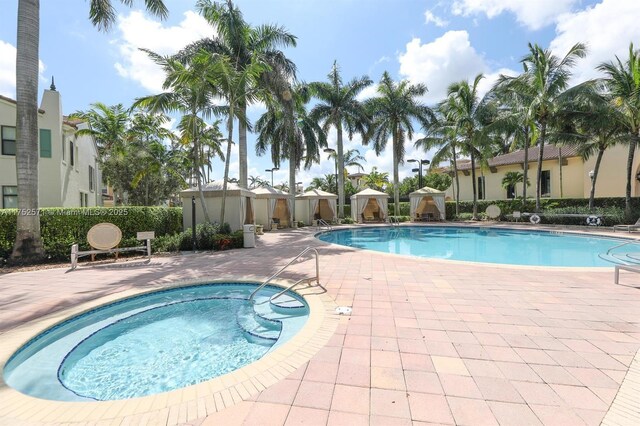 2910 NW 124th Way Unit 2910, Sunrise, FL 33323 - community pool with a patio
