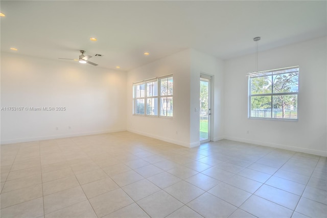 unfurnished room with light tile patterned floors, recessed lighting, visible vents, ceiling fan, and baseboards