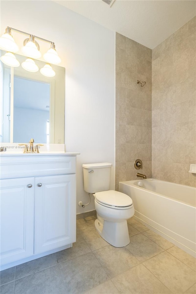 full bathroom featuring toilet, vanity, shower / tub combination, baseboards, and tile patterned floors