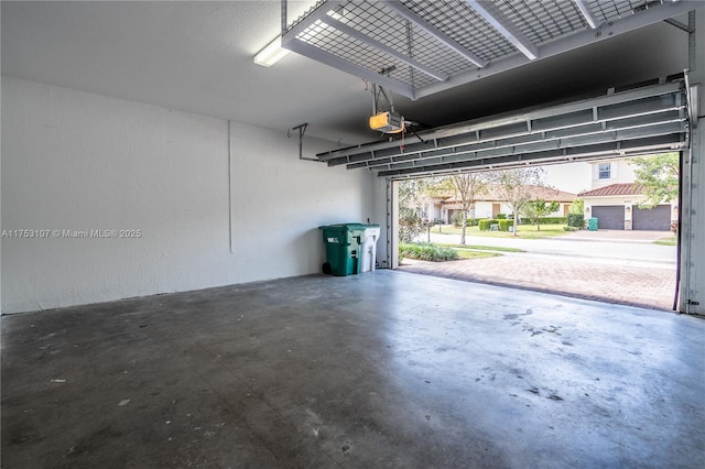 garage featuring a garage door opener