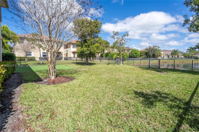 view of yard featuring fence and a residential view