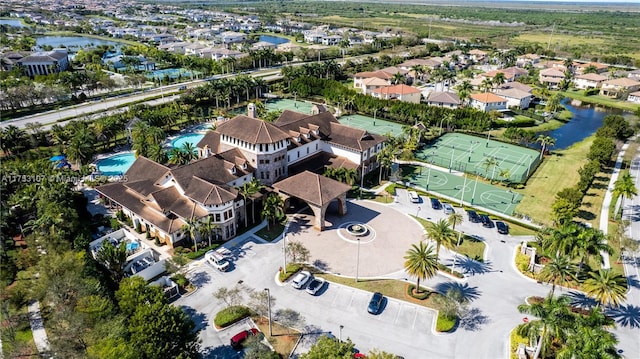 birds eye view of property with a water view and a residential view