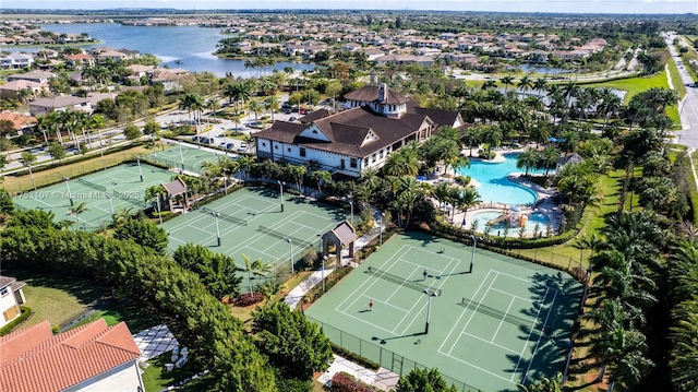 drone / aerial view with a water view and a residential view