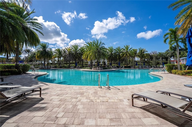 community pool with a patio area